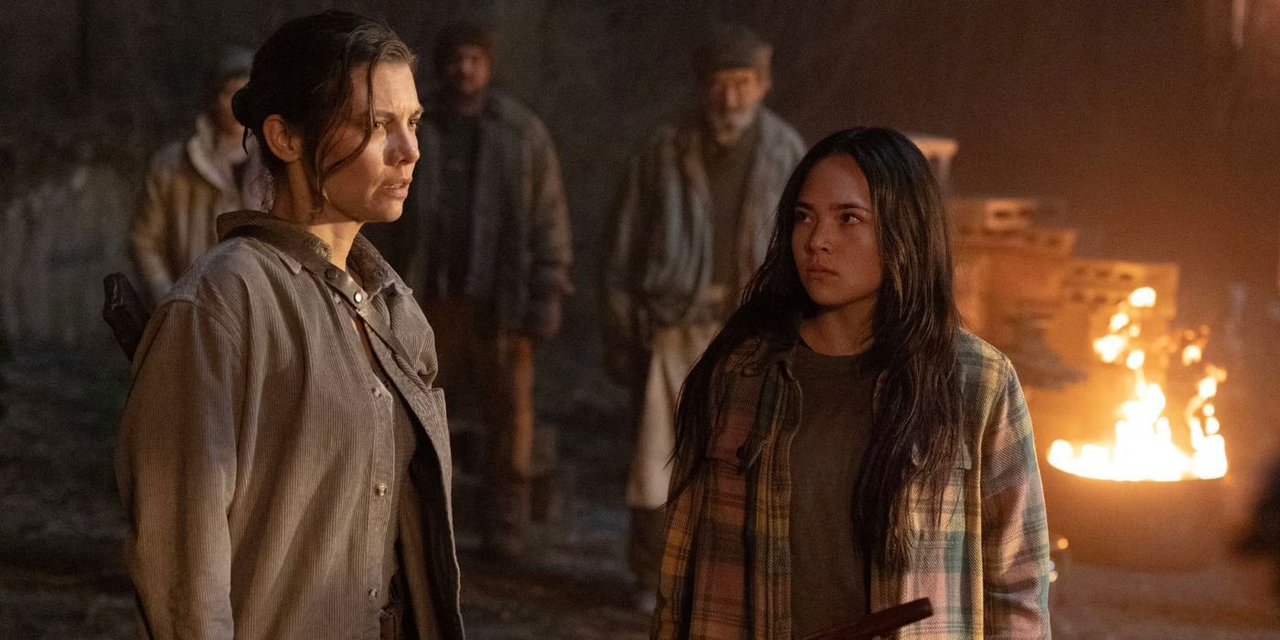Lauren Cohan&rsquo;s Maggie looks over a burning trash can while having a conversation in TWD Dead City