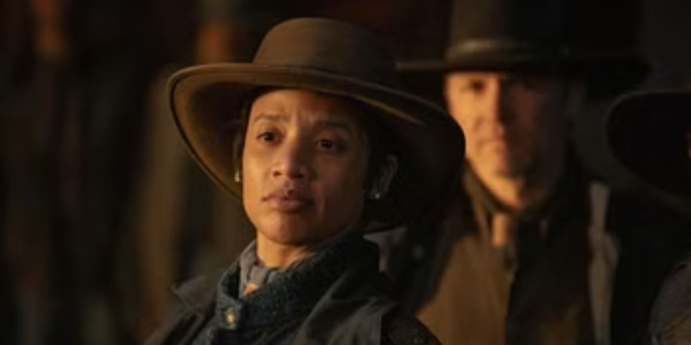 Dascha Polanco wears a cowboy hat and looks off-screen
