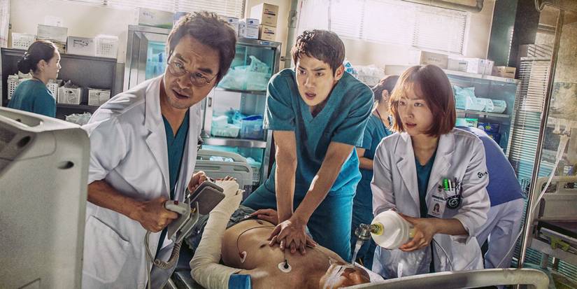 The three leads of Dr. Romantic performing CPR on a patient.