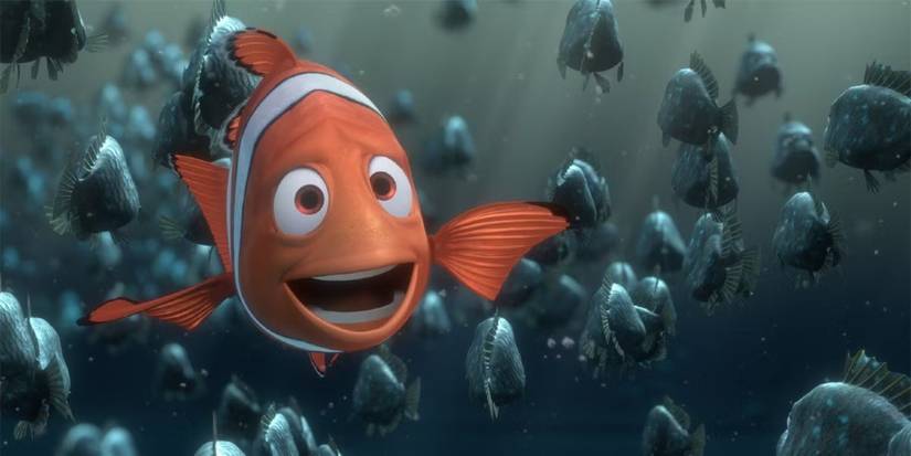Marlin, a clownfish voiced by Albert Brooks talks and gestures as other fish swim behind in Finding Nemo.