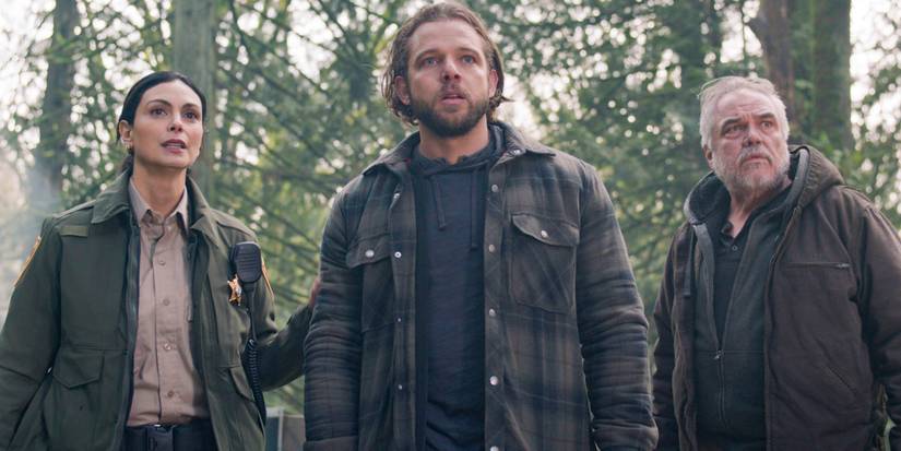 Morena Baccarin, Max Thieriot, W. Earl Brown in a forest looking ahead in Fire Country Season 3, Episode 16.