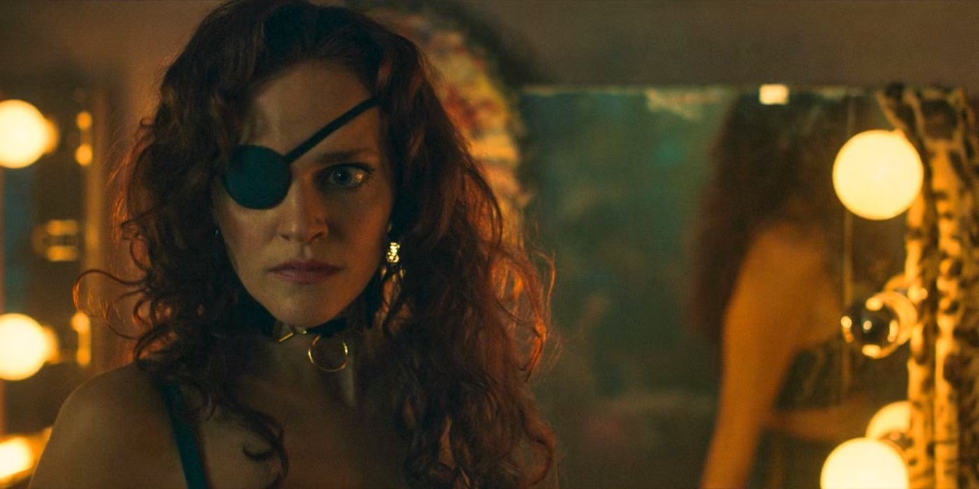 Janine (Madeline Brewer) with her eye patch in front of a mirror in Season 6 of &lsquo;Handmaid&rsquo;s Tale&rsquo;