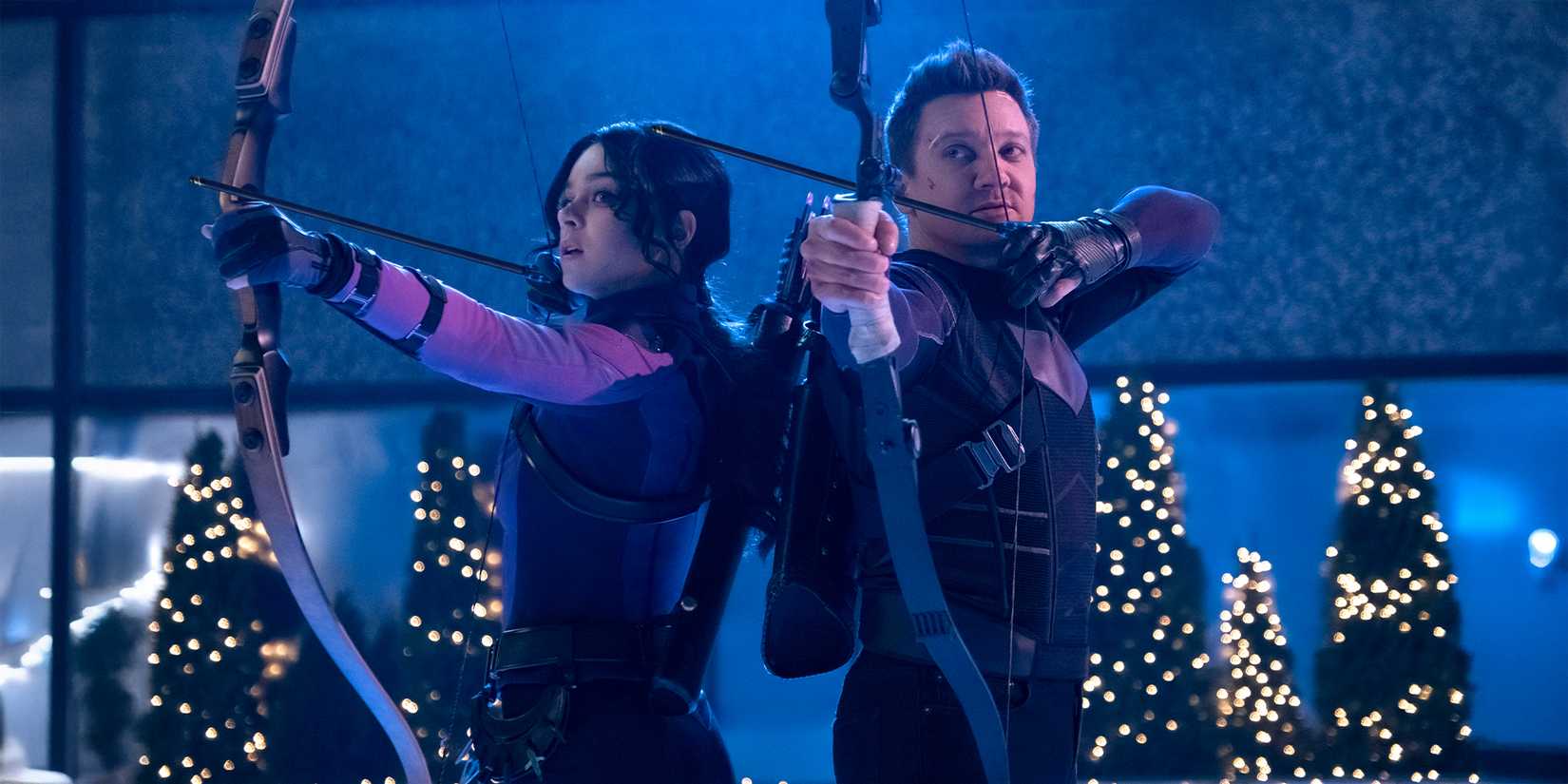 Hailee Steinfeld and Jeremy Renner draw their arrows in a scene from Hawkeye Season 1.