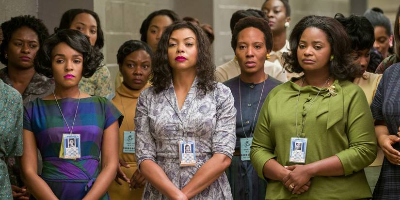 Mary, Katherine, and Dorothy standing with many women behind them in Hidden Figures