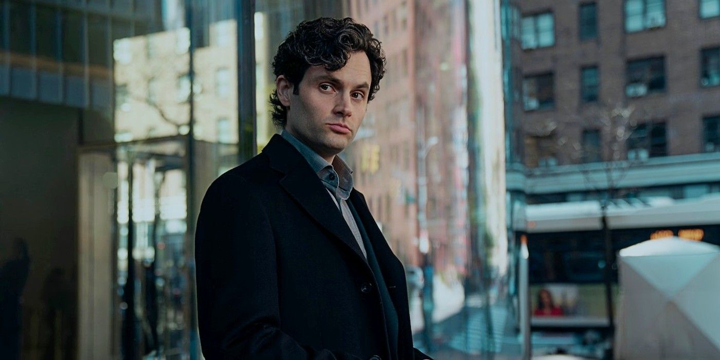 Penn Badgley as Joe Goldberg in You Season 5 standing outside a building and looking to the side.