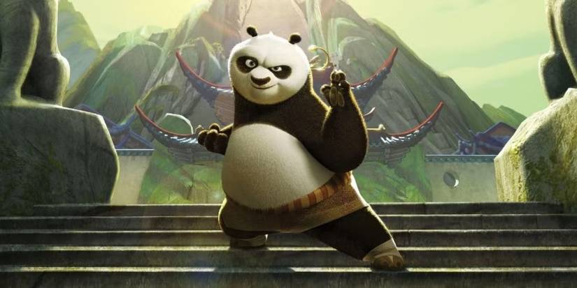 The character Po, a panda voiced by Jack Black, poses in a martial arts stance on stairs in Kung Fu Panda.