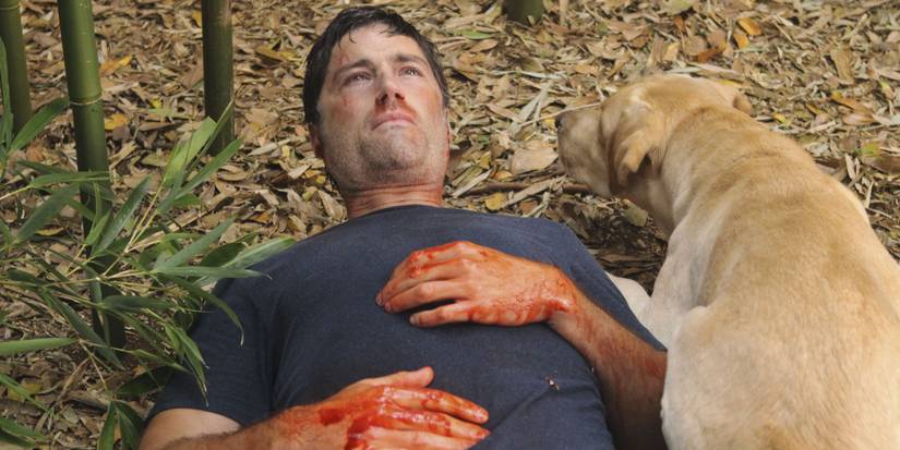 Jack lying down with blood on his hands in the series finale of Lost - The End (2010)