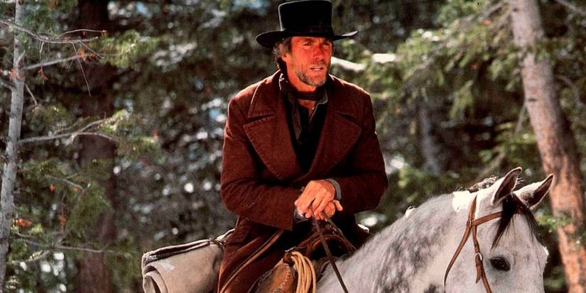 The Preacher (Clint Eastwood) riding on his horse in Pale Rider.