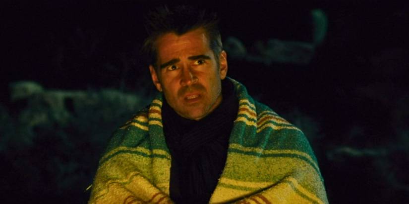 Colin Farrell as Marty in Seven Psychopaths sits in the desert at night