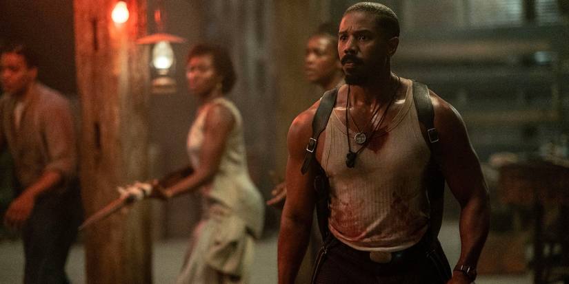 Michael B. Jordan as Smoke / Stack, gearing up to fight in Sinners
