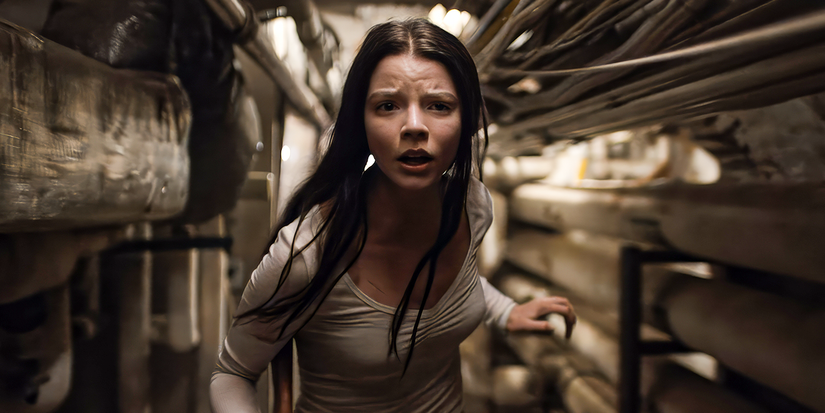 Anya Taylor-Joy as Casey Cooke runs toward the camera in maintenance hallway in Split