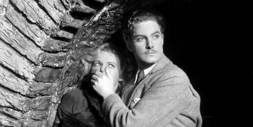 Robert Donat covering Madeleine Carroll's mouth in The 39 Steps
