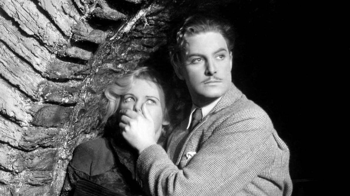 Robert Donat covering Madeleine Carroll's mouth in The 39 Steps