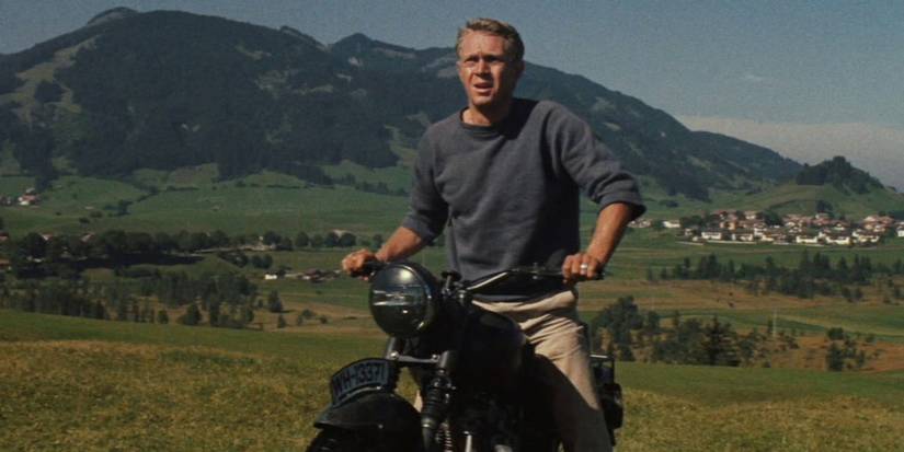 Steve McQueen on a motorbike looking ahead in The Great Escape - 1963