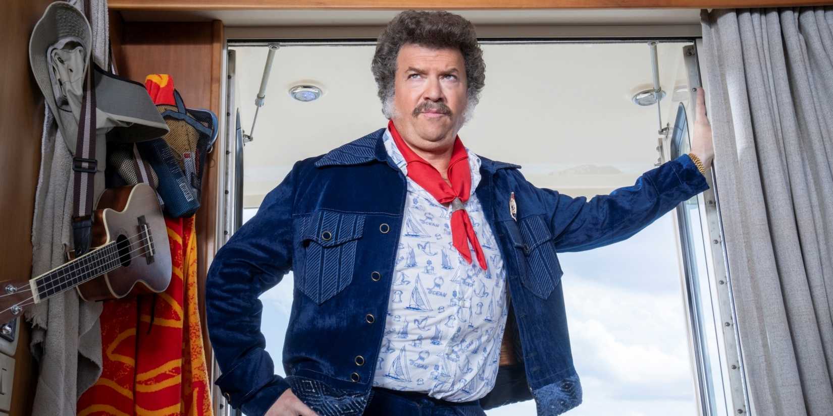 Danny McBride as Jesse with his left arm extended and his hand on the wall in The Righteous Gemstones.