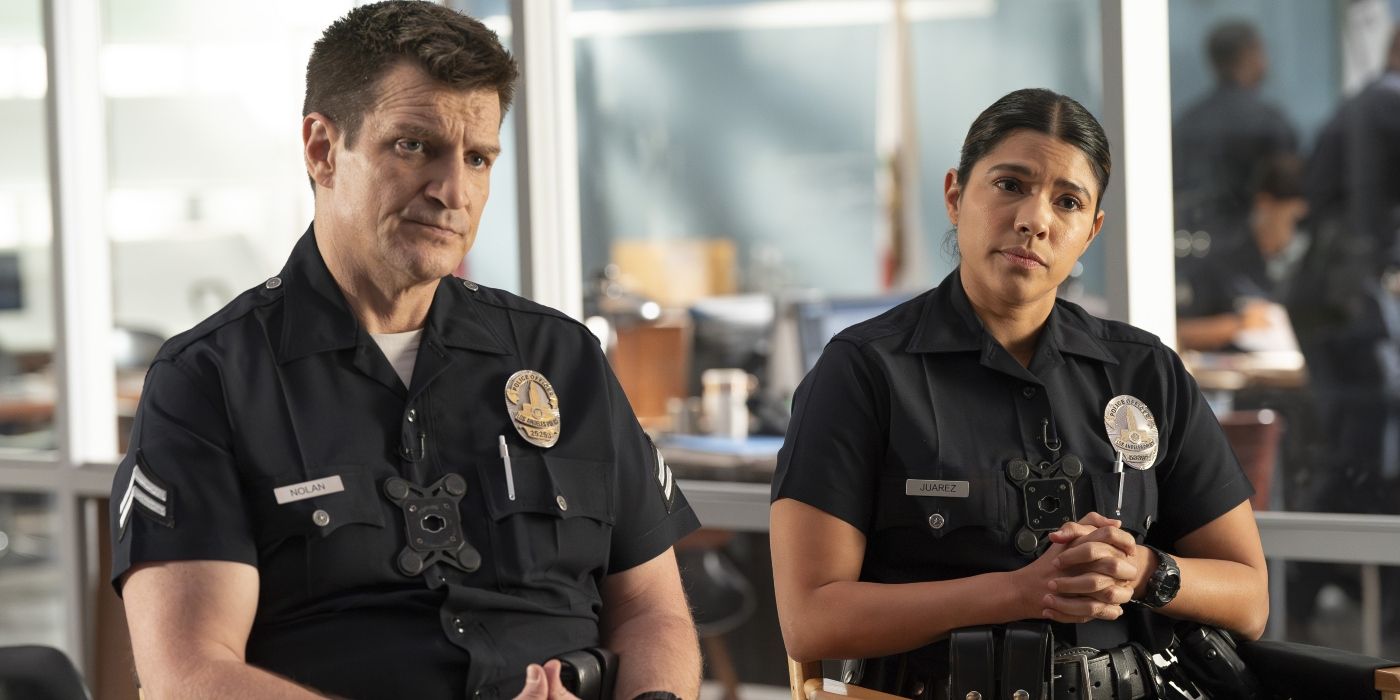 Nolan and Celina, seated in police uniforms in the station, in 'The Rookie'