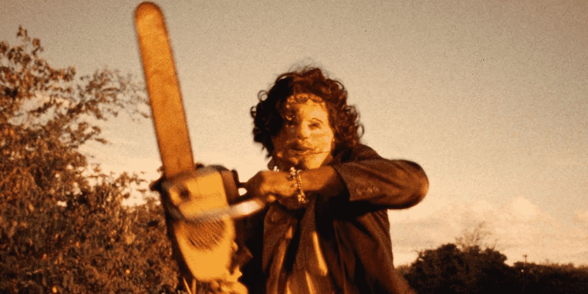 Gunnar Hansen as Leatherface wielding his chainsaw in The Texas Chain Saw Massacre