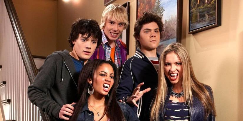 Benny, Rory, Ethan, Sarah, and Erica stand on stairs with some bearing fangs in My Babysitter's a Vampire.