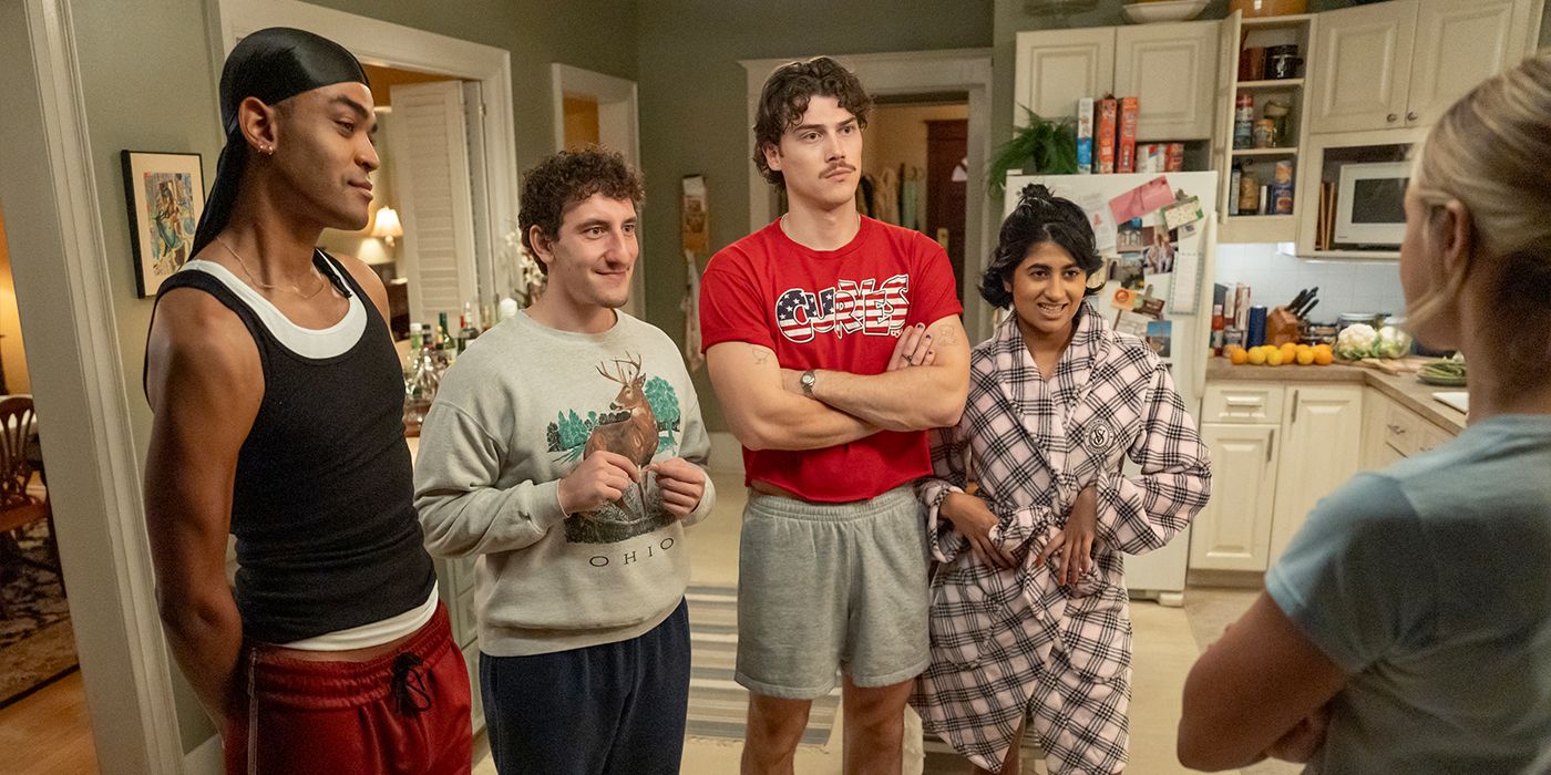 The cast stand in a kitchen in their pajamas and talk to someone in Adults.