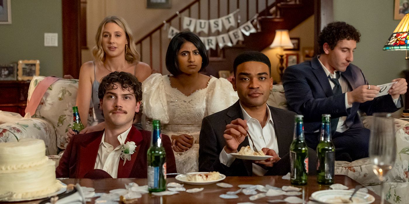 The cast of Adults lounge in formal wear with a "just married" sign behind them in the Season 1 finale.