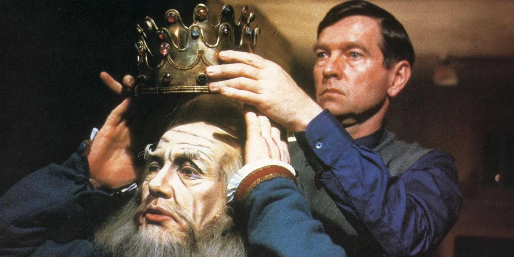 Tom Courtenay as Norman putting a costume crown on Albert Finney as Sir's head in The Dresser.