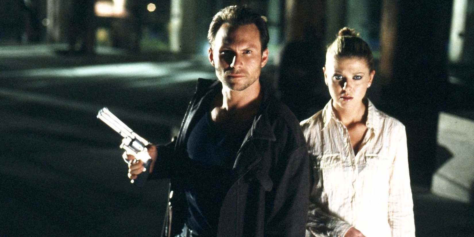 A man and a woman looking ahead in Alone in the Dark