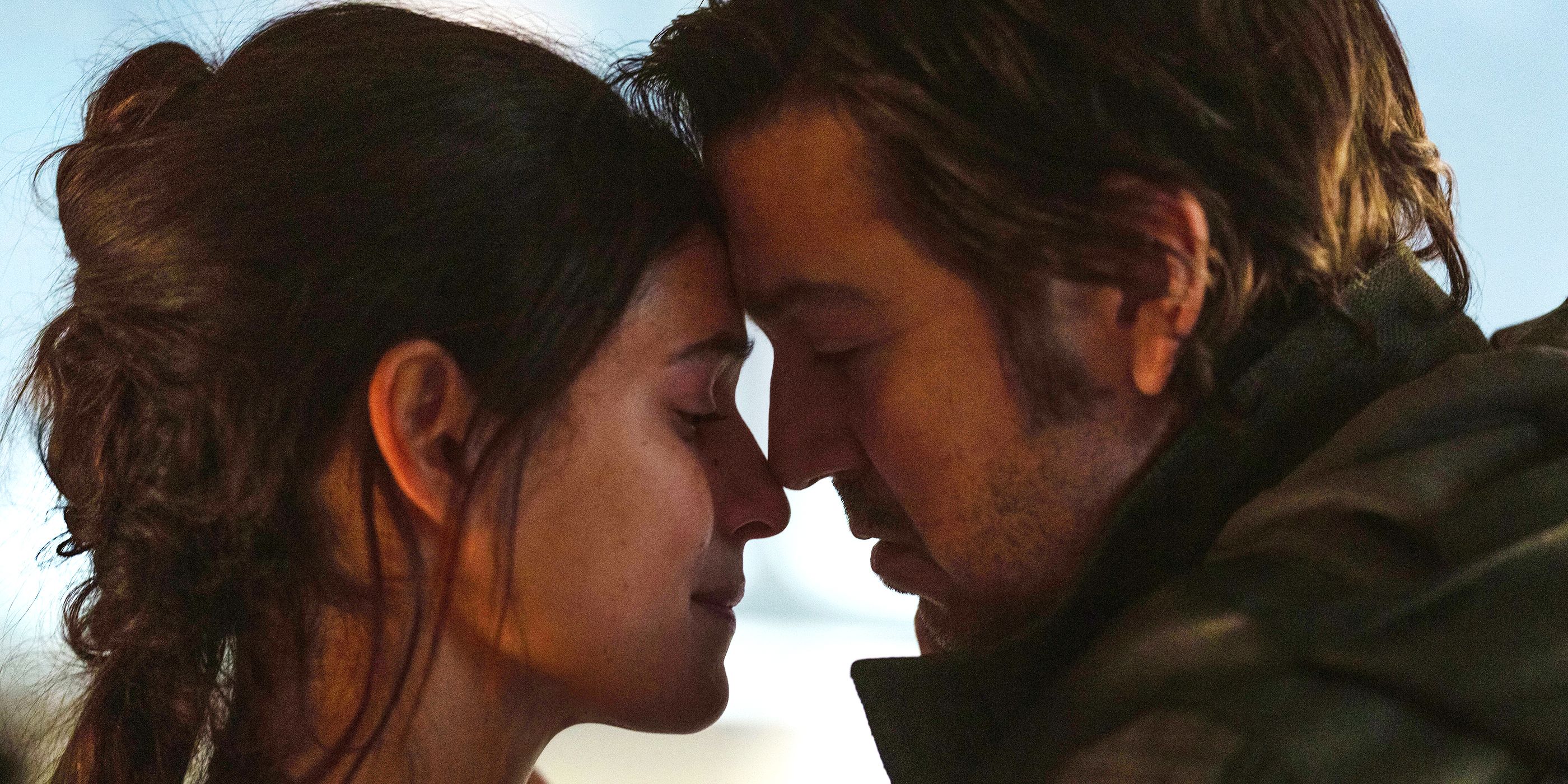 Adria Arjona as Bix and Diego Luna as Cassian share an intimate moment in a scene from Andor on Disney+