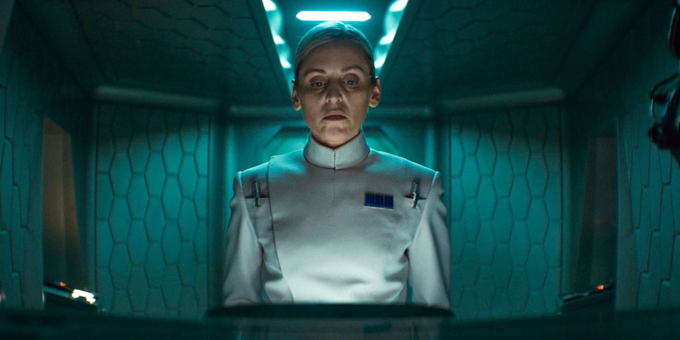 Dedra Meero (Denise Gough) standing in front of a communications screen in a small room in Andor Season 2