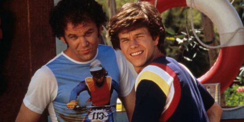 John C. Reilly and Mark Wahlberg in vintage clothing looking to the mid-distance in Boogie Nights.