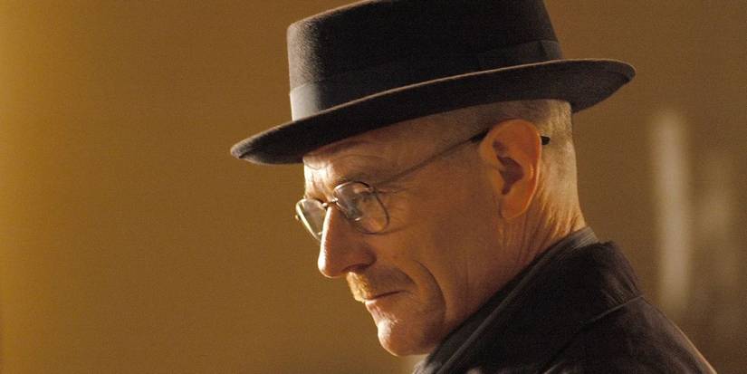 Bryan Cranston as Walter White in profile wearing a hat and glasses and looking ahead in Breaking Bad.