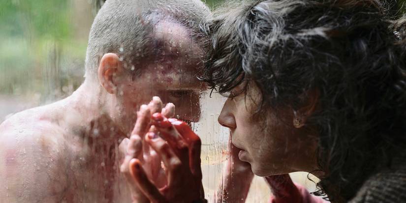 Jonah Wren Phillips as Oliver looking at Sally Hawkins through a glass window in a scene from Bring Her Back.