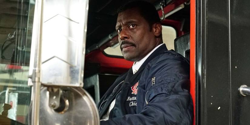 Eamonn Walker as Battalion Chief Wallace Boden looks concerned, sitting in a fire truck on 'Chicago Fire.'