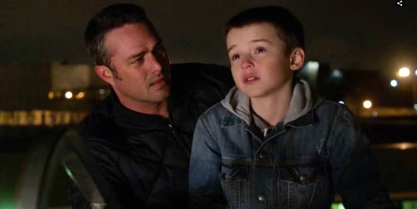 Taylor Kinney as Lieutenant Kelly Severide and Maxwell Jenkins as J.J. Holloway on Chicago Fire.