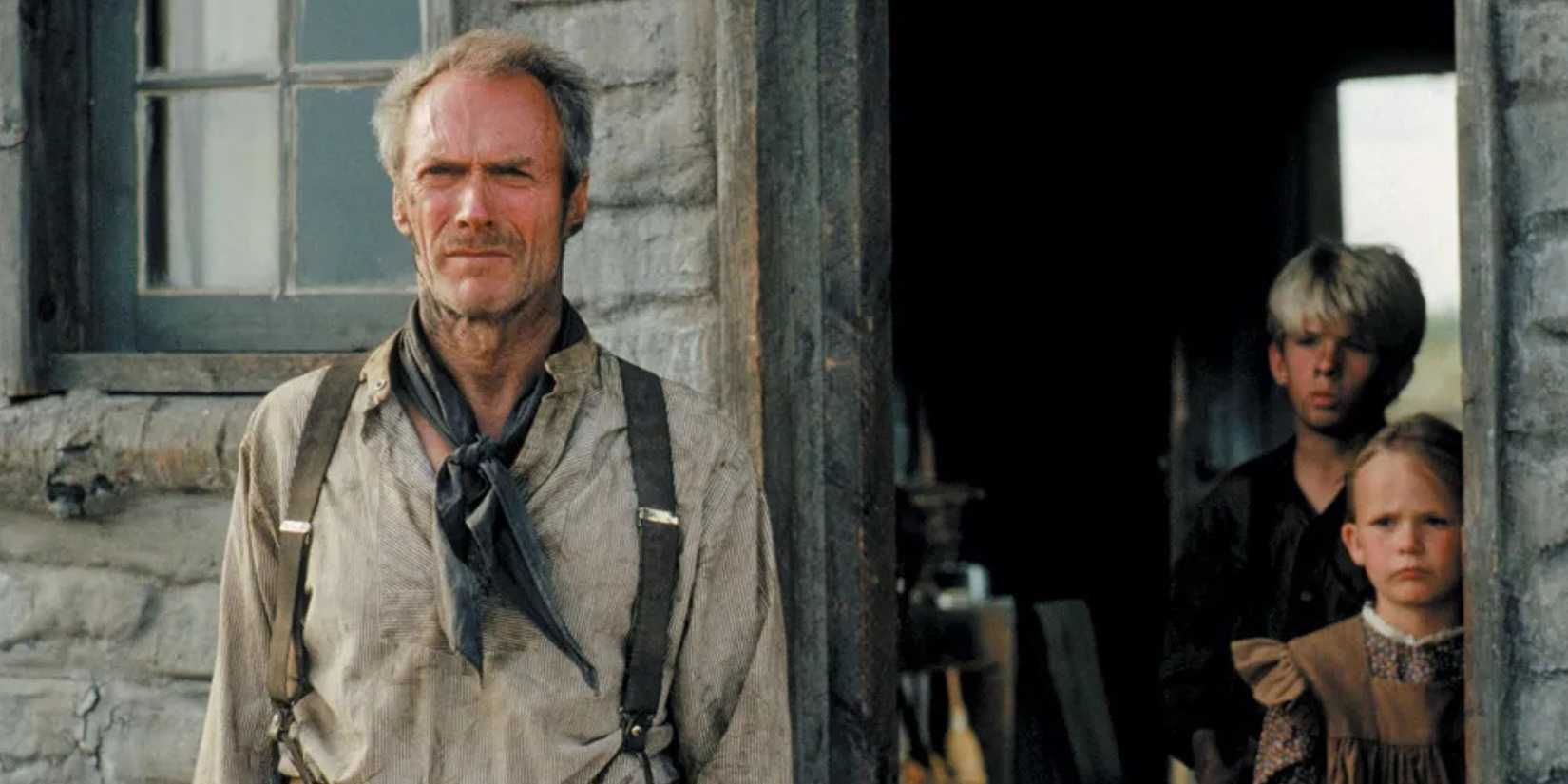 Clint Eastwood in front with Aline Levasseur and Shane Thomas Meier behind in the doorway in Unforgiven.
