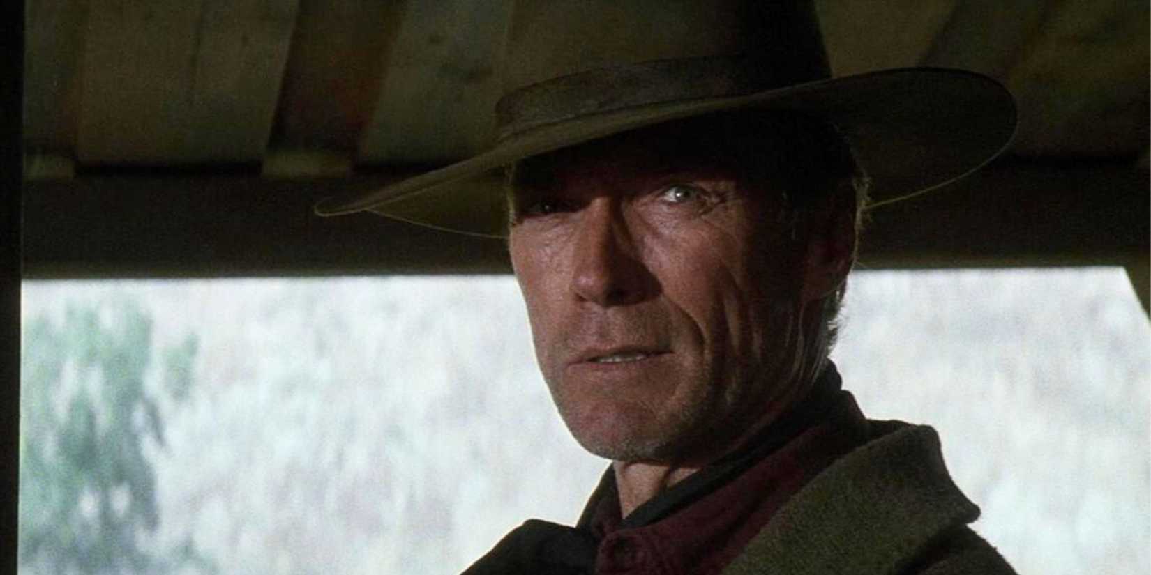 Clint Eastwood as William Munny in a cowboy hat, looking to the side in Unforgiven (1992).