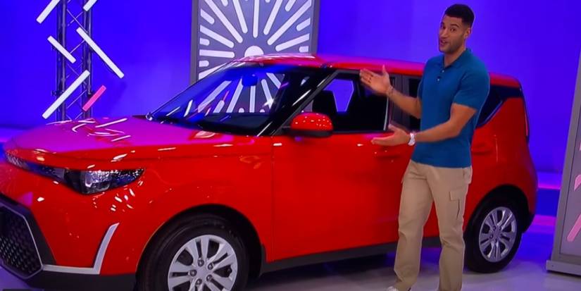 Devin Goda shows off the car up for grabs in Switcheroo on The Price is Right.