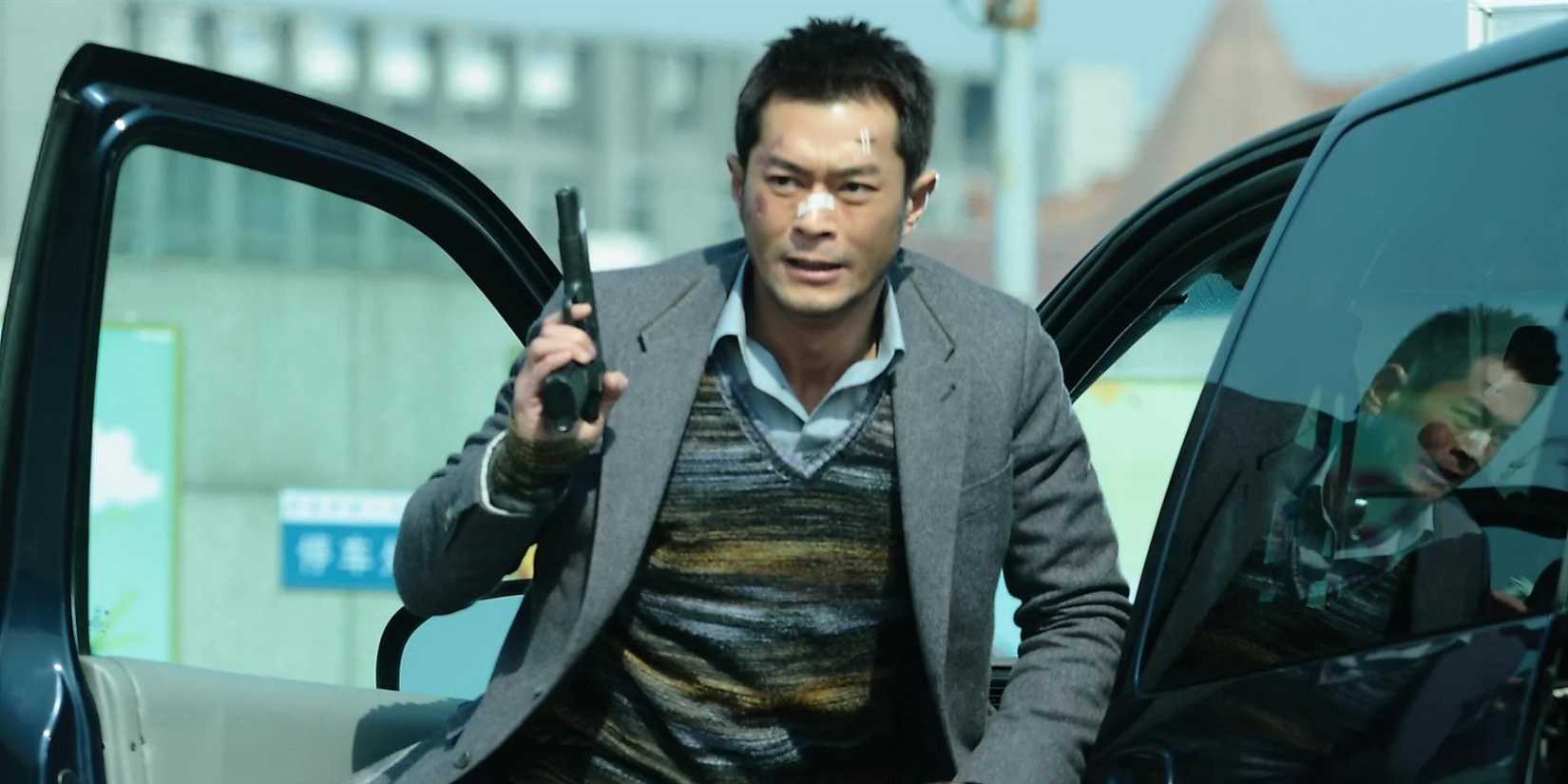 A man coming out of a car holding a gun in Drug War