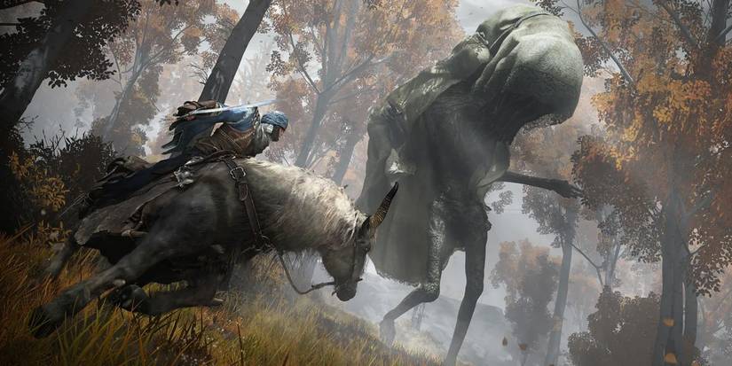A man on horseback fighting a creature in Elden Ring