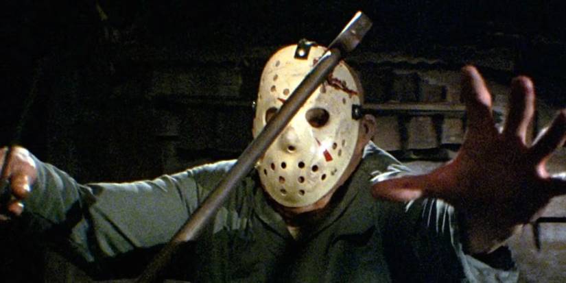 Jason Voorhees (Richard Brooker) with an axe in his mask in 'Friday the 13th Part III'