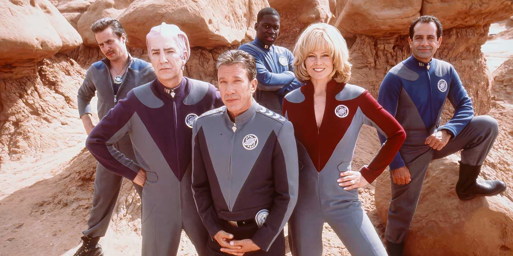 The cast of Galaxy Quest posing in a desert