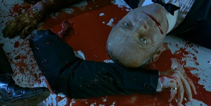 A bloody corpse next to a dismembered arm in 'Ghost Ship'
