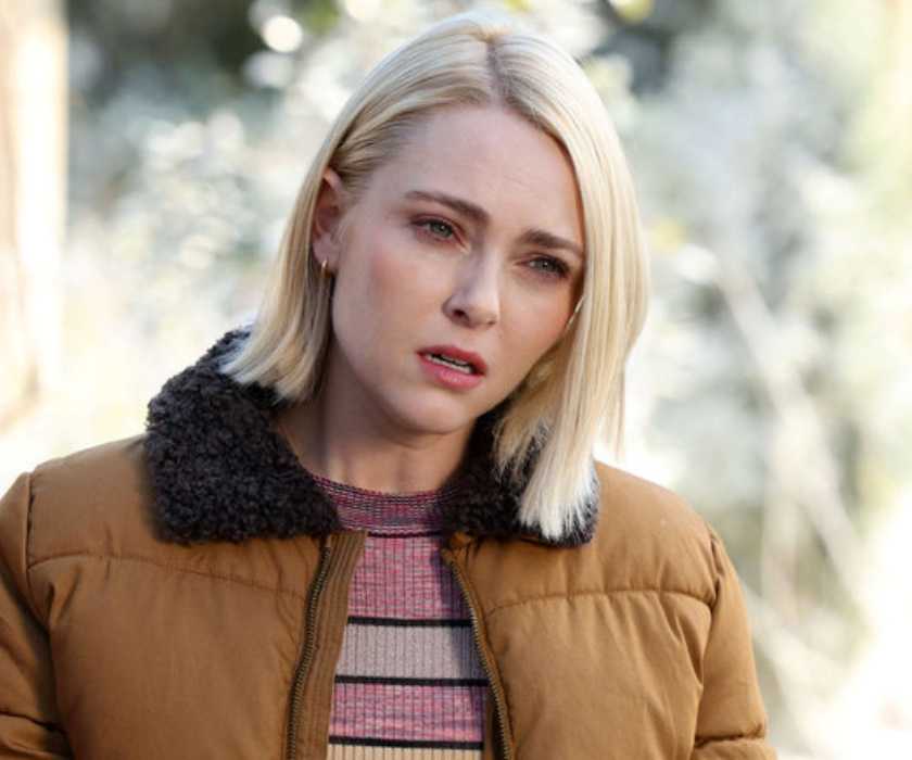 AnnaSophia Robb as Alice in a puffy coat and furry collar looking concerned in Grosse Pointe Garden Society