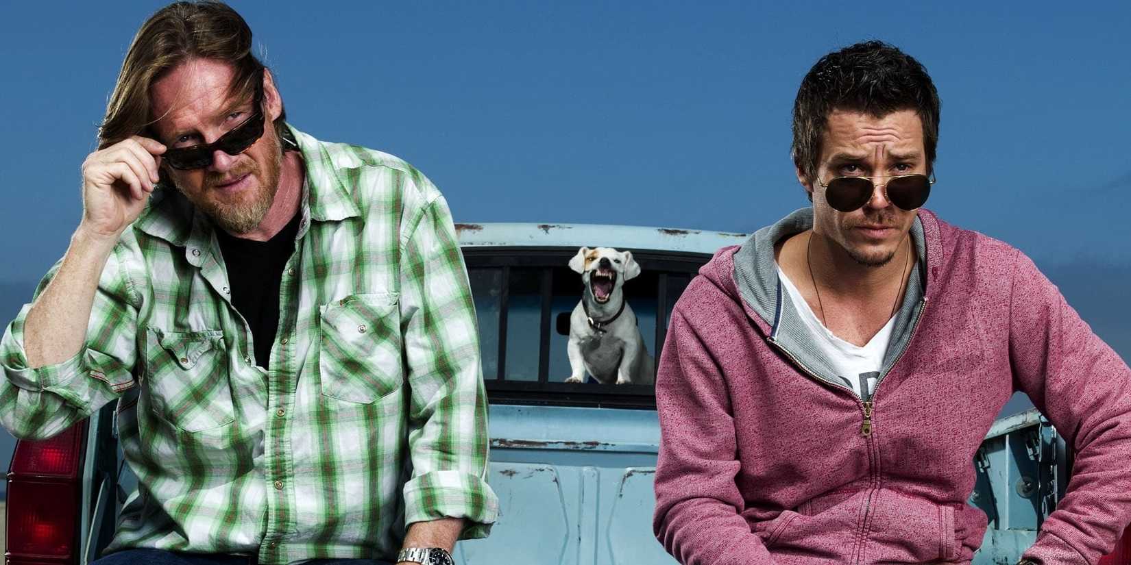 Hank (Donal Logue) and Britt (Michael Raymond-James) with a small dog bearing its teeth in Terriers.