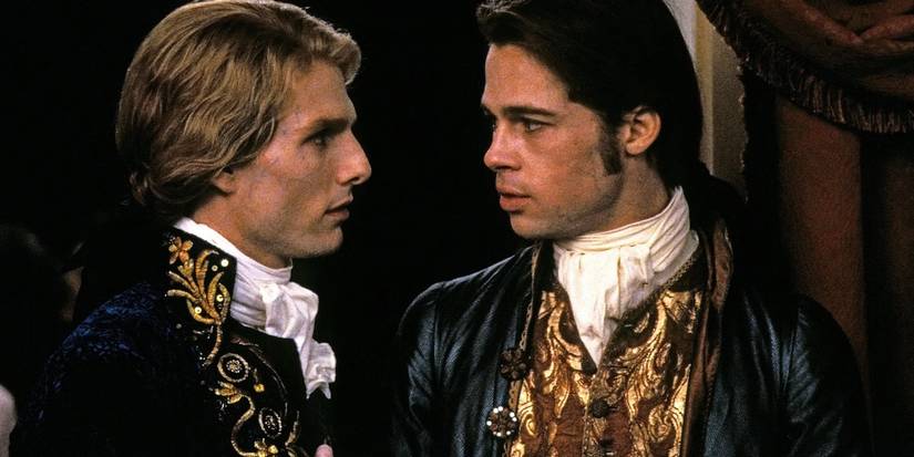 Tom Cruise and Brad Pitt stare at each other in period clothing in Interview With the Vampire.