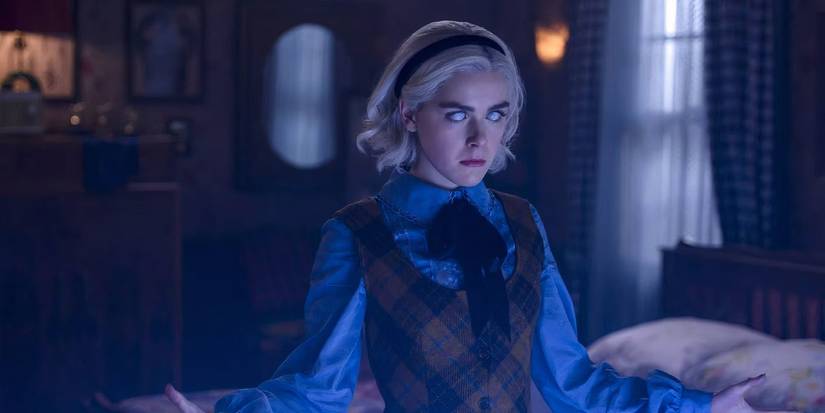 A still of Kiernan Shipka as Sabrina Spellman performing a spell in The Chilling Adventures of Sabrina.