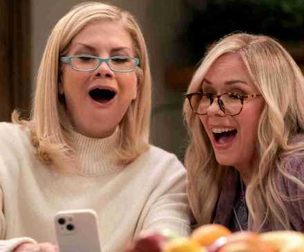 Kristen Johnston and Leanne Morgan put on glasses and laugh at their phones