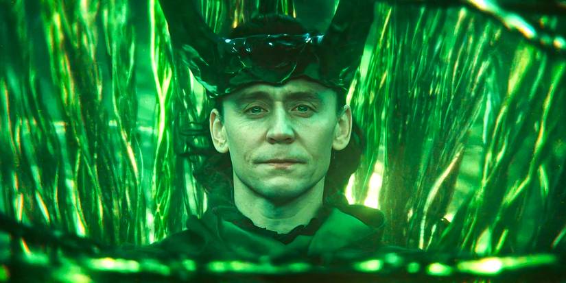 Tom Hiddleston as Loki God of Stories looking at peace in Loki.