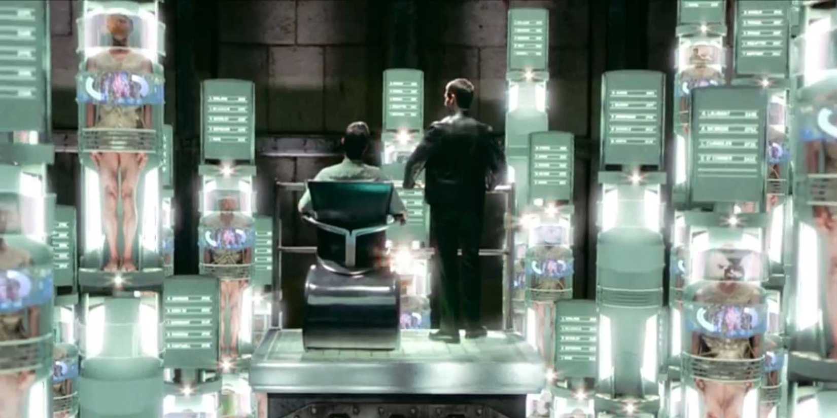 Tom Cruise and Tim Blake Nelson stand amidst a sprawling grid of prisoners in 'Minority Report'