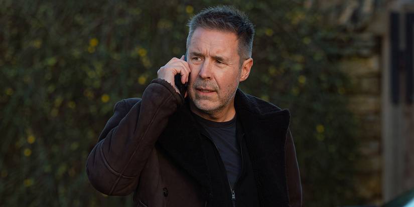 Paddy Considine talking on a cell outside in MobLand