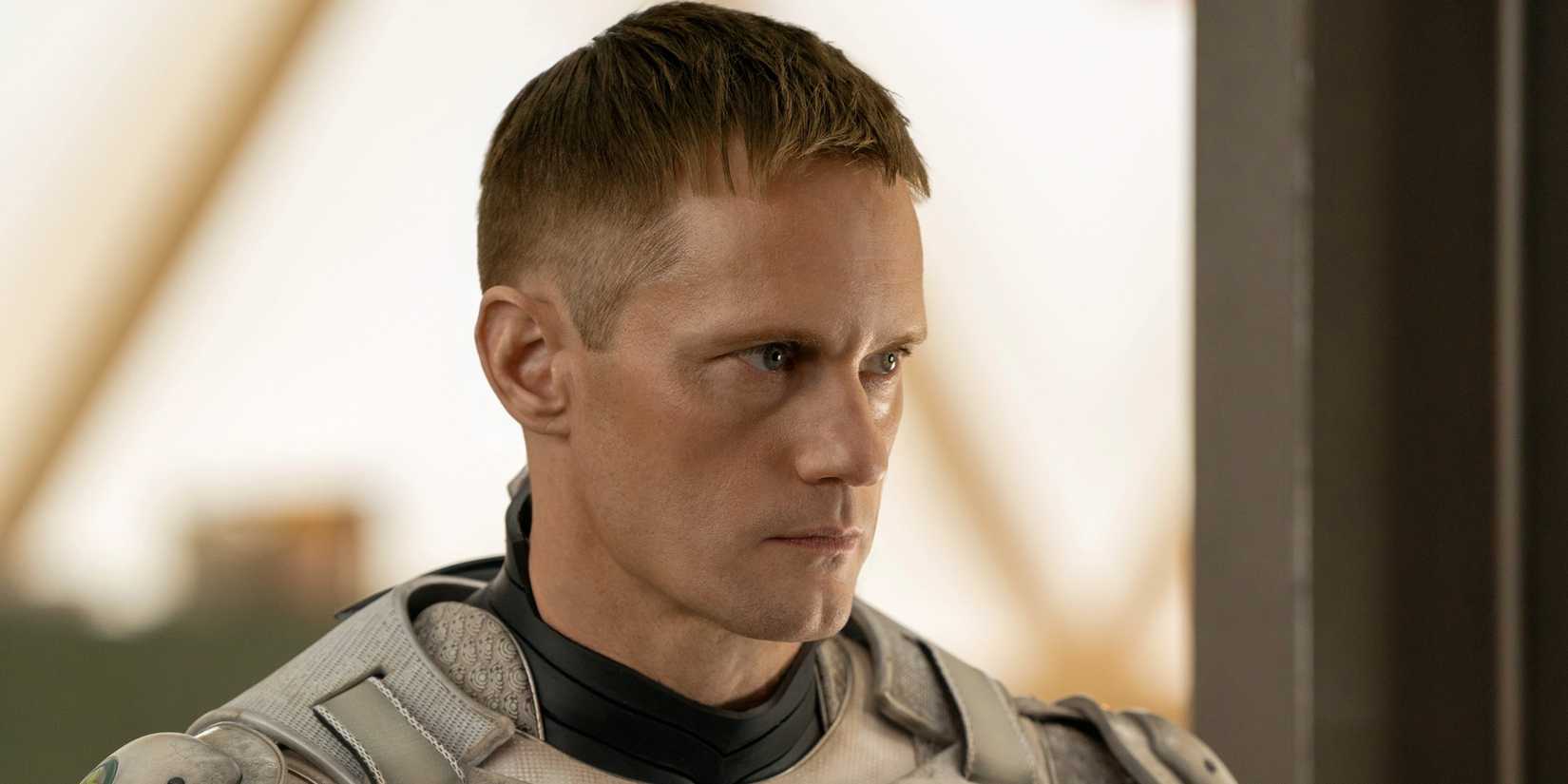 Alexander Skarsgard as Murderbot in the SecUnit suit looking to the left in the Apple TV+ series Murderbot